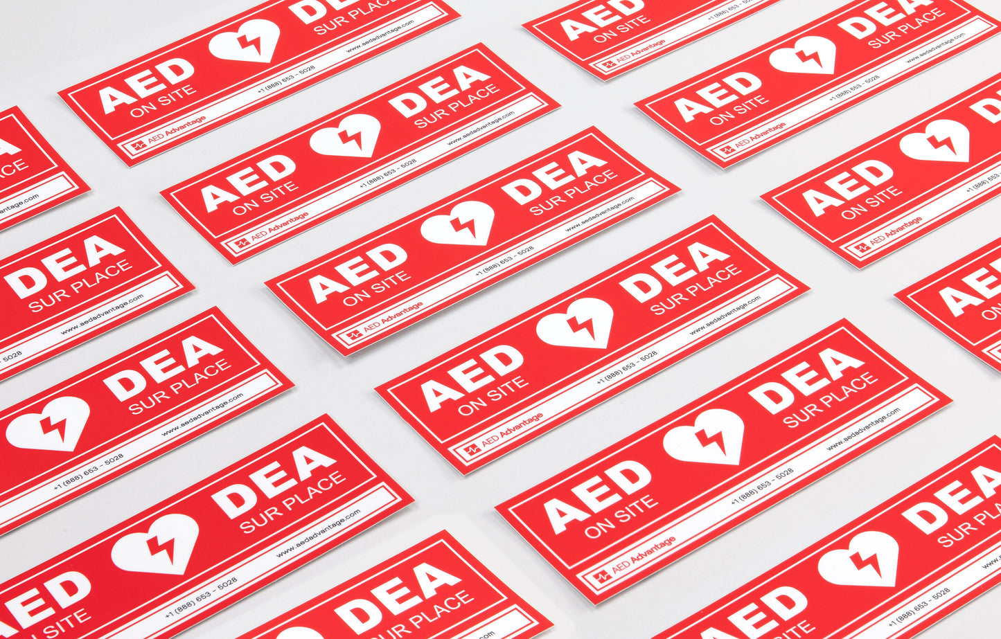 A collage of red rectangular decals that adhere to doors indicating an AED is present at a facility
