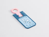 A blue and pink rectangular key for the Philips HeartStart FRx AED
