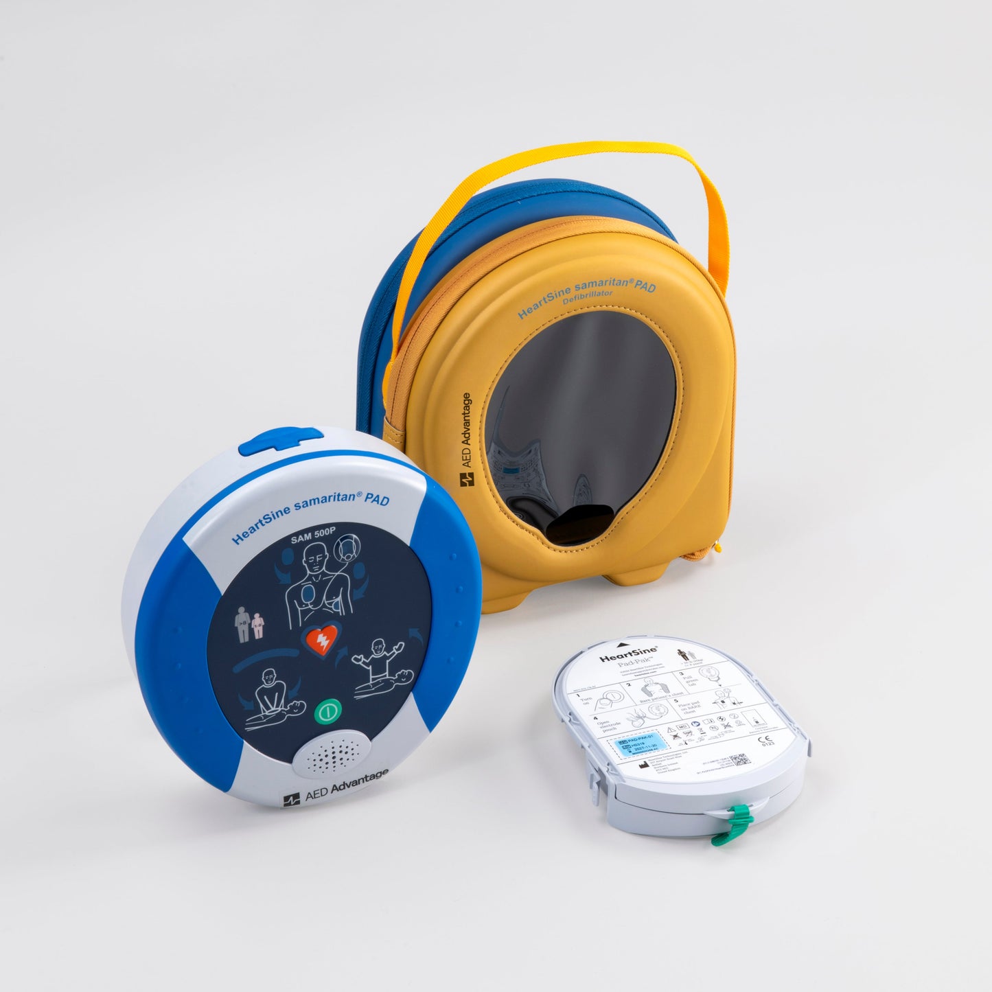 A blue and gray HeartSine 500P AED with its yellow carry case and pads cartridge