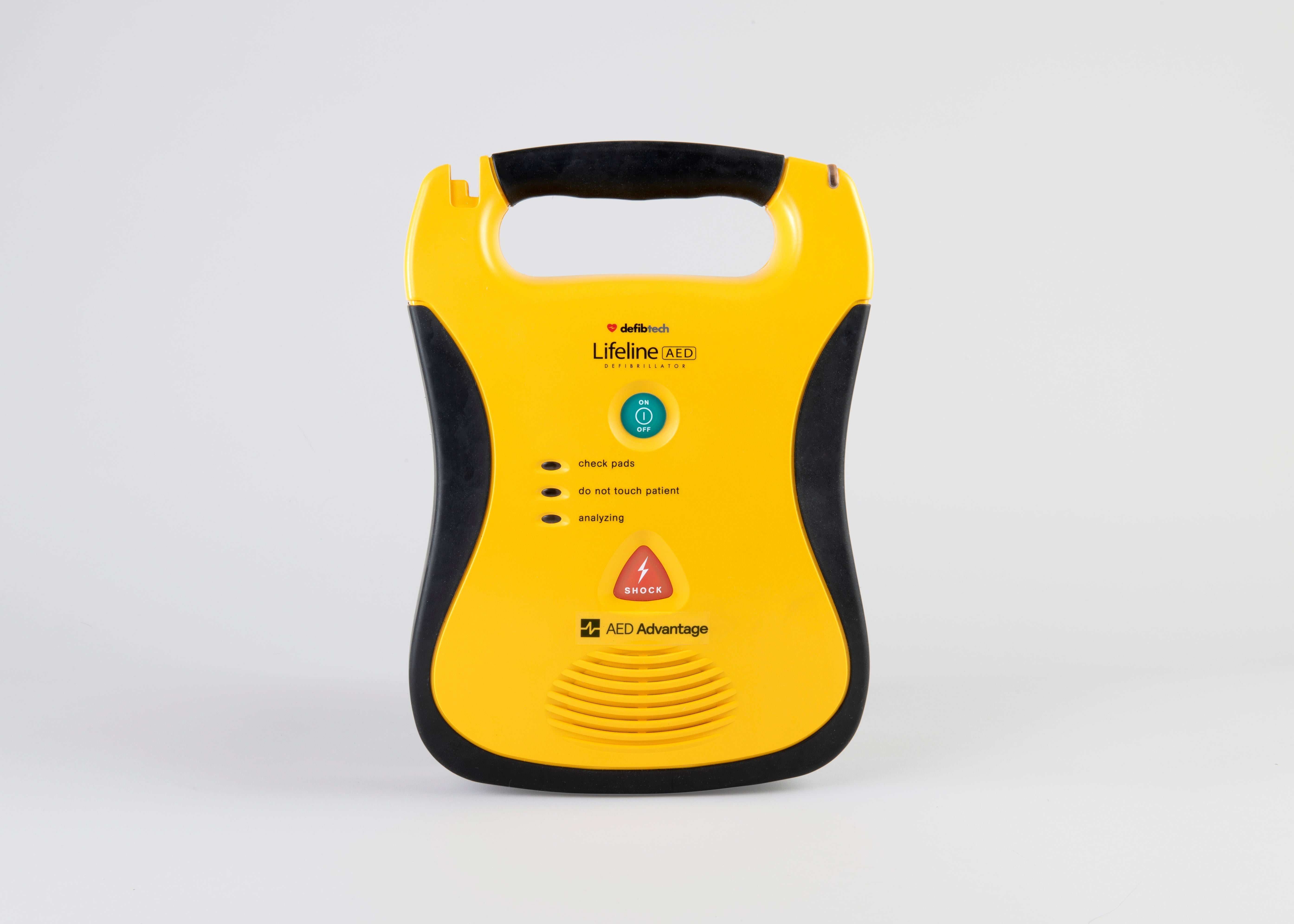 A black and yellow Defibtech Lifeline AED displayed head on with a gray background 