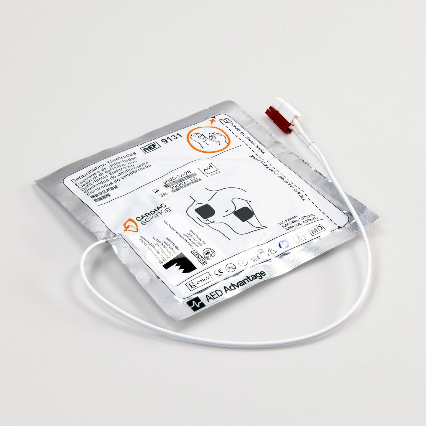 A white and silver square foil package with a white connector cord containing electrodes for the Powerheart G3 defibrillator
