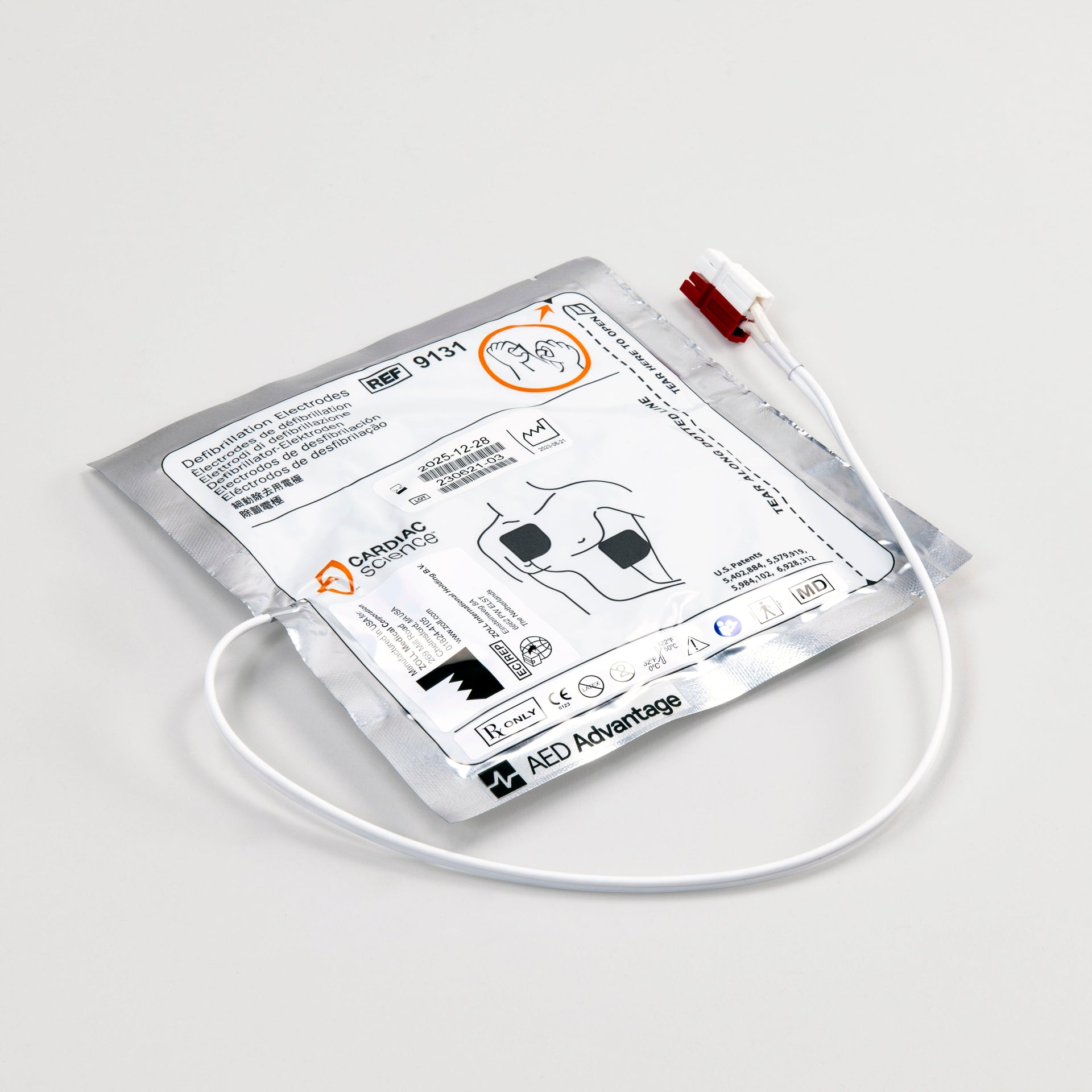A white and silver square foil package with a white connector cord containing electrodes for the Powerheart G3 defibrillator