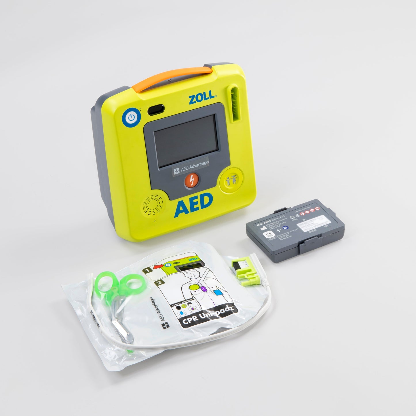 A green ZOLL AED 3 machine standing next to its green semi-rigid carry case