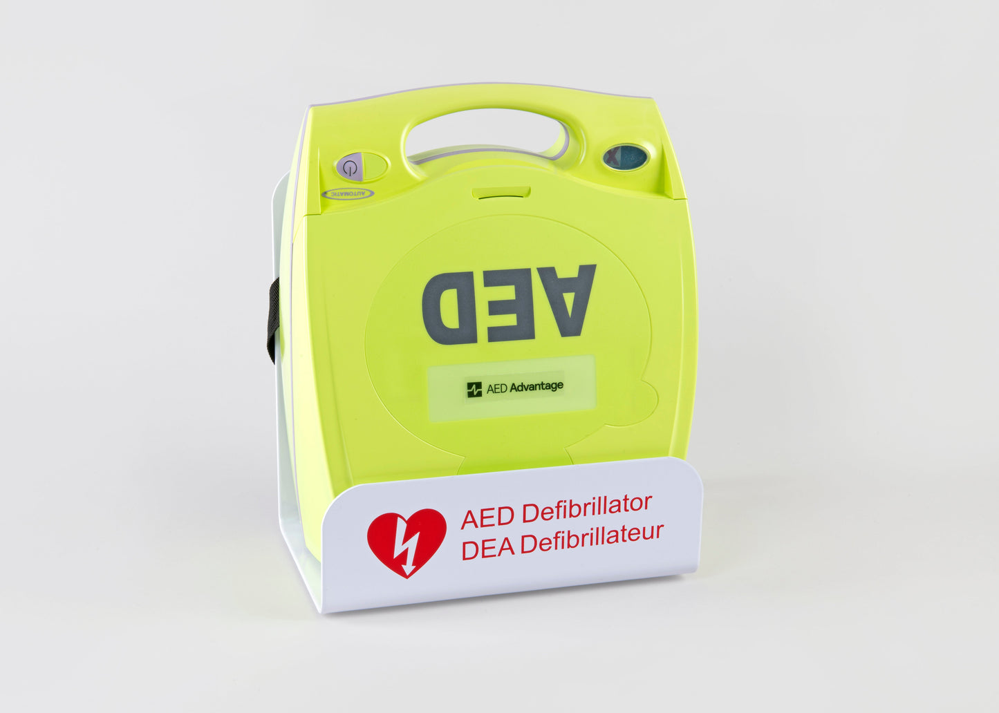 A green ZOLL AED Plus machine displayed in a white metal wall mount bracket